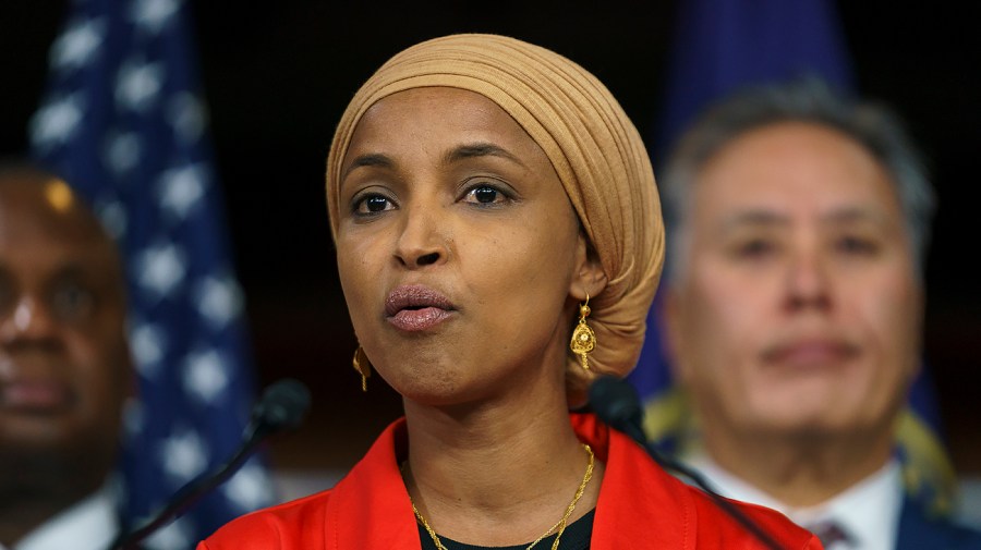 Representative Ilhan Omar speaks to reporters.