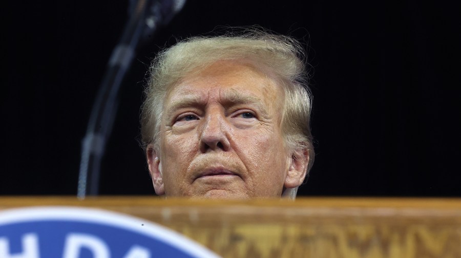 Donald Trump is seen at a podium