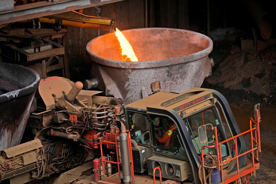 A worker operates a truck as molten slag is poured into a container at PT Vale Indonesia's nickel processing plant in Sorowako, South Sulawesi, Indonesia, Tuesday, Sept. 12, 2023. Demand for critical minerals like nickel and cobalt is surging as climate change hastens a transition to renewable energy, boosting carbon emissions by miners and processors of such materials. (AP Photo/Dita Alangkara)