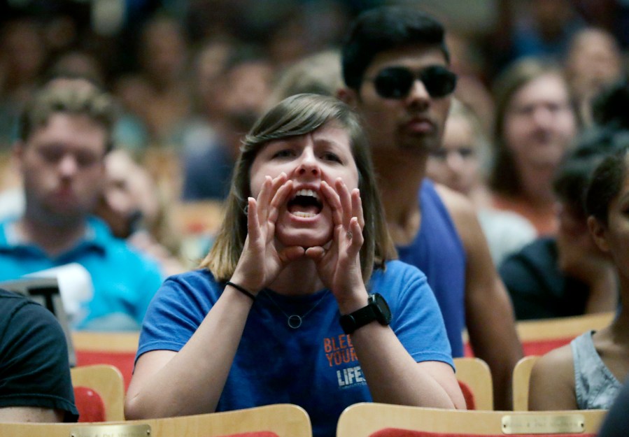 FILE- A protester shouts down White Nationalist Richard Spencer during a speech at the University of Florida in Gainesville, Fla., Oct. 19, 2017. New polling finds that America’s college campuses are seen as far friendlier to liberals than to conservatives when it comes free speech. Polling from the University of Chicago and the AP-NORC Center for Public Affairs Research finds that 47% of adult Americans say liberals are free to express their views on college campuses, while 20% said the same of conservatives. (AP Photo/Chris O'Meara, File)