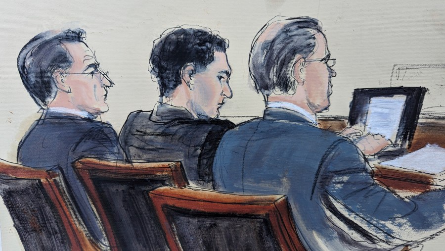 This courtroom sketch shows Samuel Bankman Fried, center, flanked by his defense attorneys Christian Everdell, left and Mark Cohen, right, as jury selection began in his fraud trial, Tuesday, Oct. 3, 2023. (AP Photo/Elizabeth Williams)