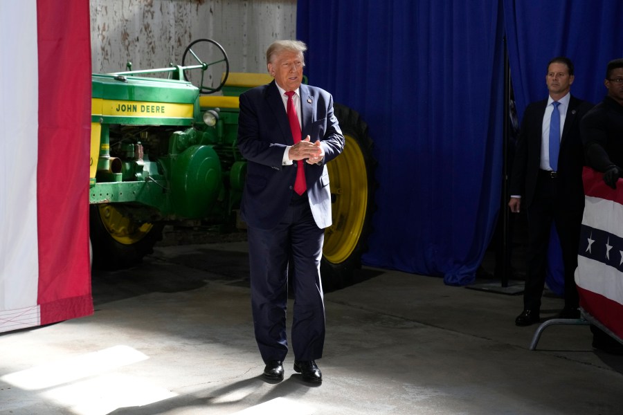 Former President Donald Trump arrives at a commit to caucus rally, Saturday, Oct. 7, 2023, in Waterloo, Iowa. (AP Photo/Charlie Neibergall)