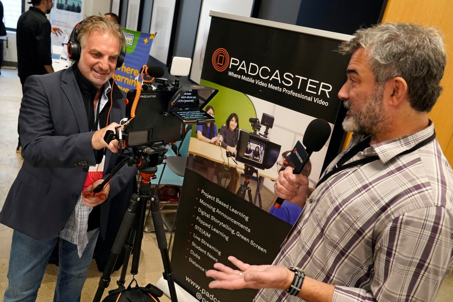 PADCASTER President Jon Goldberg, left, and CEO Josh Apter, demonstrate their Padcaster Studio for remote and virtual learning, at EDTECHWEEK 2023, in New York, Tuesday, Oct. 3, 2023. As soon as the federal pandemic relief started arriving at America's schools, tech companies by the dozens wanted a chance to prove that their software or equipment was exactly what schools needed. (AP Photo/Richard Drew)