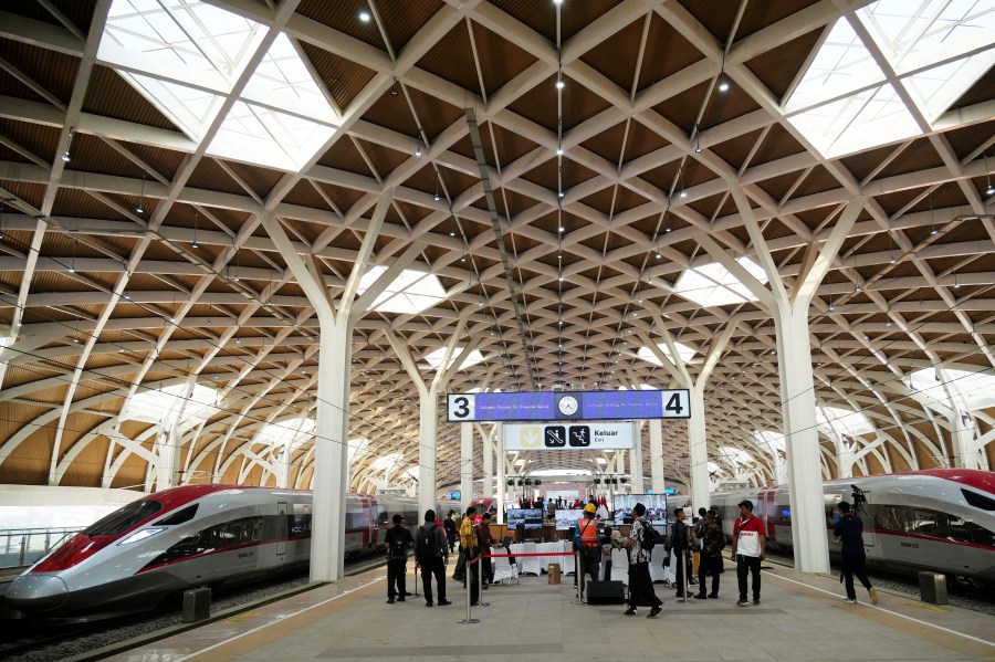 FILE - High-speed train is parked during the opening ceremony for launching Southeast Asia's first high-speed railway, a key project under China's Belt and Road infrastructure initiative, at Halim station in Jakarta, Indonesia on Oct. 2, 2023. China is touting its 10-year-old Belt and Road Initiative as an alternative model for economic development, releasing a government report that praises the program while glossing over criticism that it has saddled poor countries with too much debt. (AP Photo/Achmad Ibrahim, File)