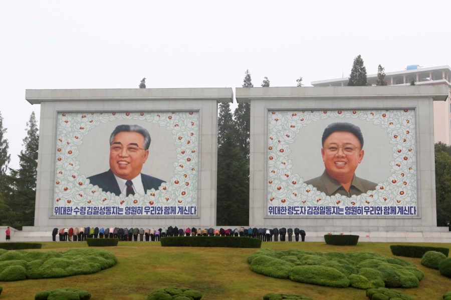 FILE - Citizens visit the portraits of the country's late leaders Kim Il Sung and Kim Jong Il on the occasion of the 78th founding anniversary of the Worker's Party of Korea in Pyongyang, North Korea, Oct. 10, 2023. The White House says that North Korea has delivered more than 1,000 containers of military equipment and munitions to Russia for its ongoing war in Ukraine. White House National Security Council spokesman John Kirby said Friday the U.S. believes Kim is seeking sophisticated Russian weapons technologies in return for the munitions to boost North Korea’s military. (AP Photo/Jon Chol Jin, file)