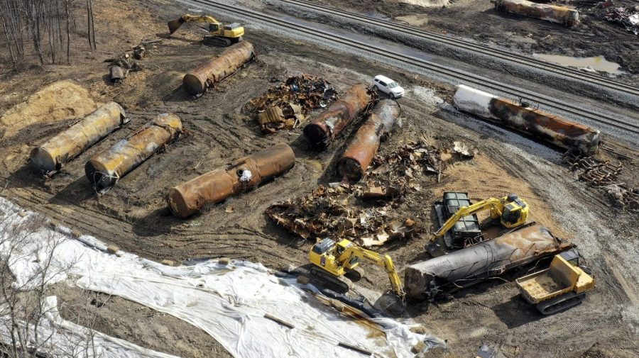 FILE - Cleanup continues, Feb. 24, 2023, at the site of a Norfolk Southern freight train derailment that happened on Feb. 3 in East Palestine, Ohio. The costs related to the East Palestine derailment continue to grow to reach $966 million for Norfolk Southern, but the railroad's service is improving and its insurance companies have started to pay their share of the cost of the crash in eastern Ohio early this year. (AP Photo/Matt Freed, File)