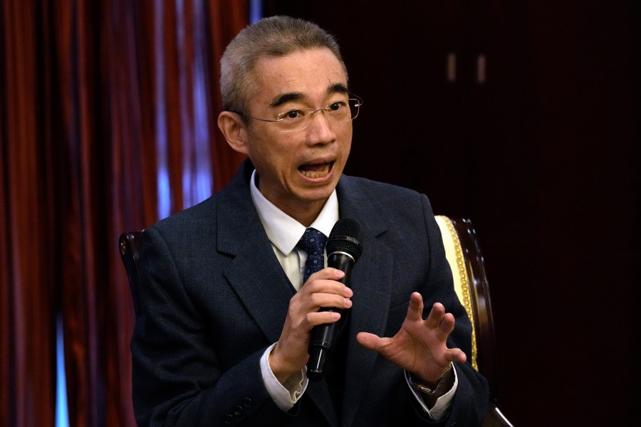 FILE - Wu Zunyou, the chief epidemiologist at China's Center for Disease Control, speaks during a press conference in Beijing, on Dec. 29, 2022. The Chinese expert who helped lead anti-covid measures that suspended access to cities and prompted protests has died Friday. Wu was 60. (AP Photo/Ng Han Guan, File)