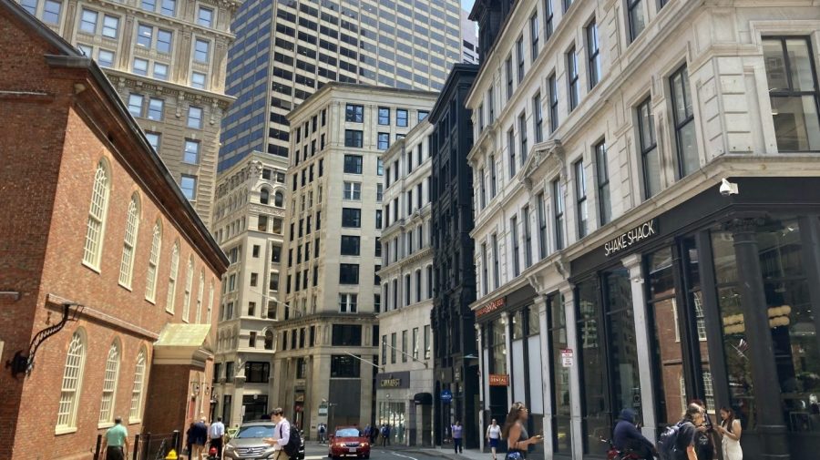 Pedestrians cross a street in downtown Boston.