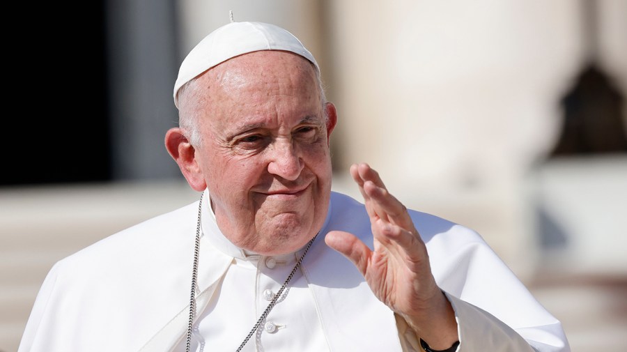 Pope Francis waves as he leaves after attending his weekly general audience in St. Peter's Square at The Vatican, Wednesday, Sept. 27, 2023.