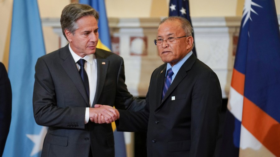 Secretary of State Antony Blinken shakes hands with Marshall Islands President David Kabua at the State Department in Washington, Sept. 29, 2022.