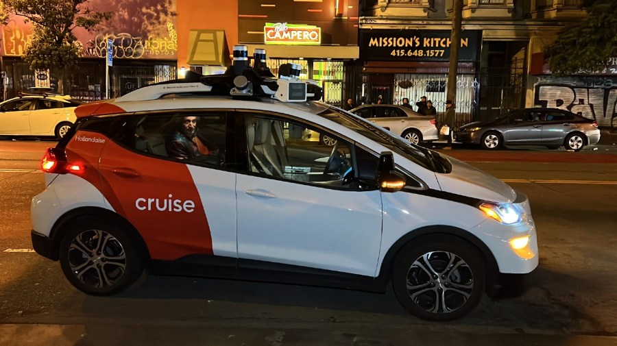 File - Associated Press reporter Michael Liedtke sits in the back of a Cruise driverless taxi that picked him up in San Francisco's Mission District, on Feb. 15, 2023.