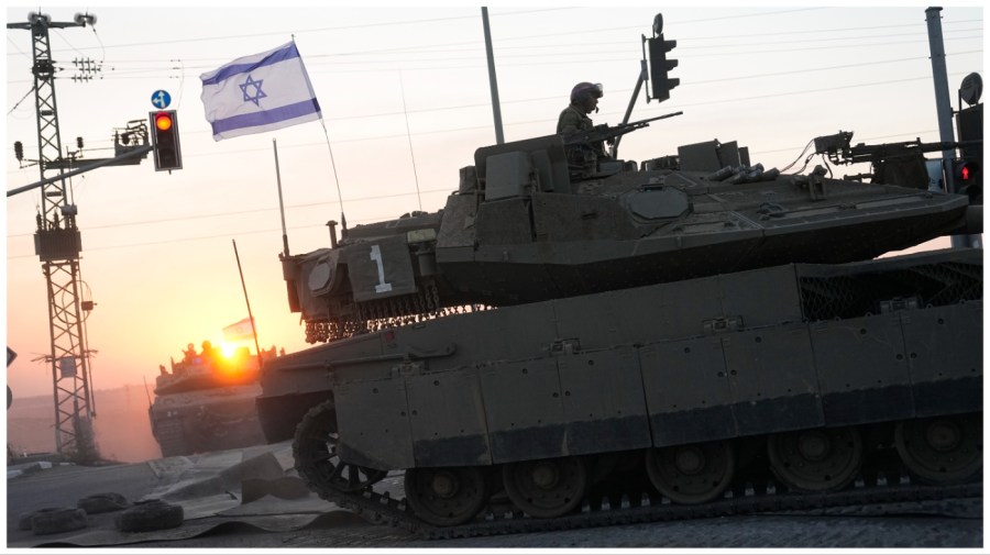 Israeli tanks head towards the Gaza Strip border in southern Israel on Thursday, Oct.12, 2023. (AP Photo/Ohad Zwigenberg)