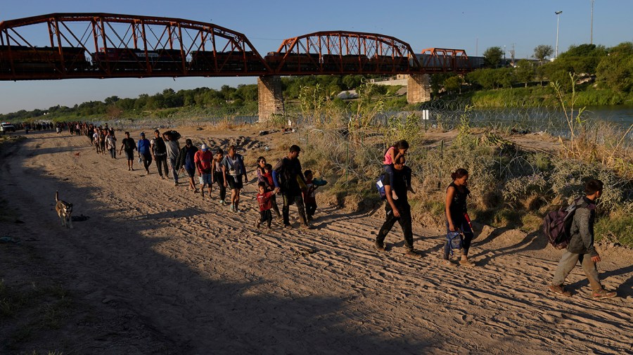 Migrants who crossed the Rio Grande and entered the U.S. from Mexico are moved for processing by U.S. Customs and Border Protection, Saturday, Sept. 23, 2023, in Eagle Pass, Texas.