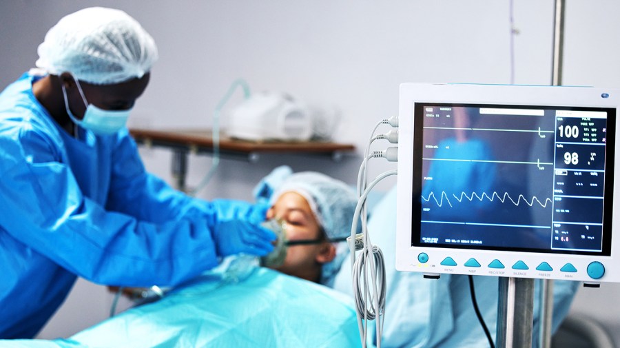 A doctor attends to a patient.