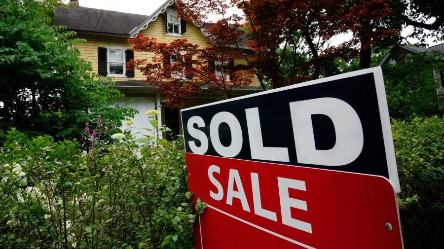 FILE - A sale sign stands outside a home in Wyndmoor, Pa., Wednesday, June 22, 2022. The CEO of the National Association of Realtors is stepping down, Thursday, Nov. 2, 2023, nearly two months before his planned retirement, a move that comes just two days after the trade group was dealt a punishing judgement in federal court over its rules on real estate agent commissions. (AP Photo/Matt Rourke, File)