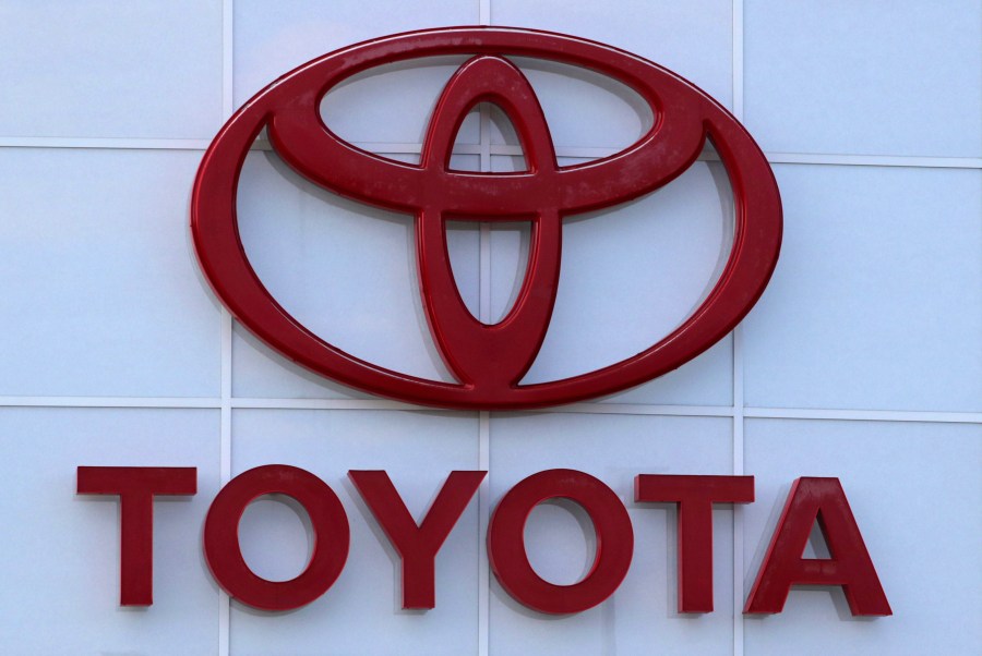 FILE - The Toyota logo is seen on a dealership, Aug. 15, 2019, in Manchester, N.H. Toyota said Wednesday, Nov. 1, 2023, that it is recalling nearly 1.9 million RAV4 small SUVs in the U.S. to fix a problem with batteries that can move during forceful turns and potentially cause a fire. (AP Photo/Charles Krupa, File)