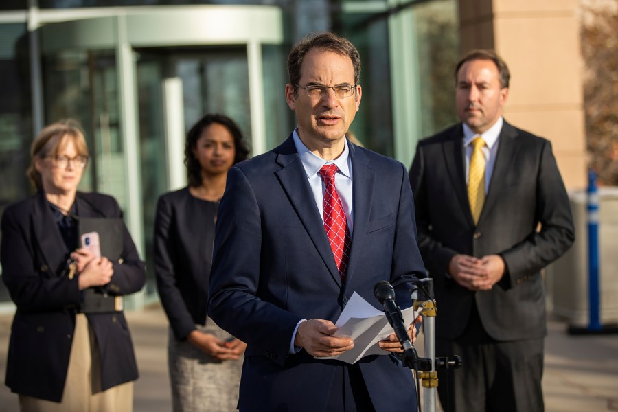 Colorado Attorney General Phil Weiser, speaks with reporters at the Adams County Justice Center in Brighton, Colo., on Monday, Nov. 6, 2023, after a jury found suspended Aurora Police Officer Nathan Woodyard not guilty over his role in the 2019 death of Elijah McClain. (Hart Van Denburg/Colorado Public Radio via AP)