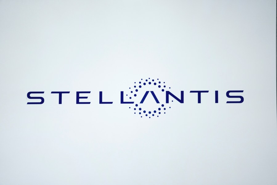 FILE - The Stellantis logo is shown at the North American International Auto Show, Sept. 13, 2023, in Detroit. On Monday, Nov. 13, Stellantis said that it will offer buyout or early retirement packages to about 6,400 nonunion U.S. salaried employees as the auto industry faces what the company is calling challenging market conditions. (AP Photo/Paul Sancya, File)