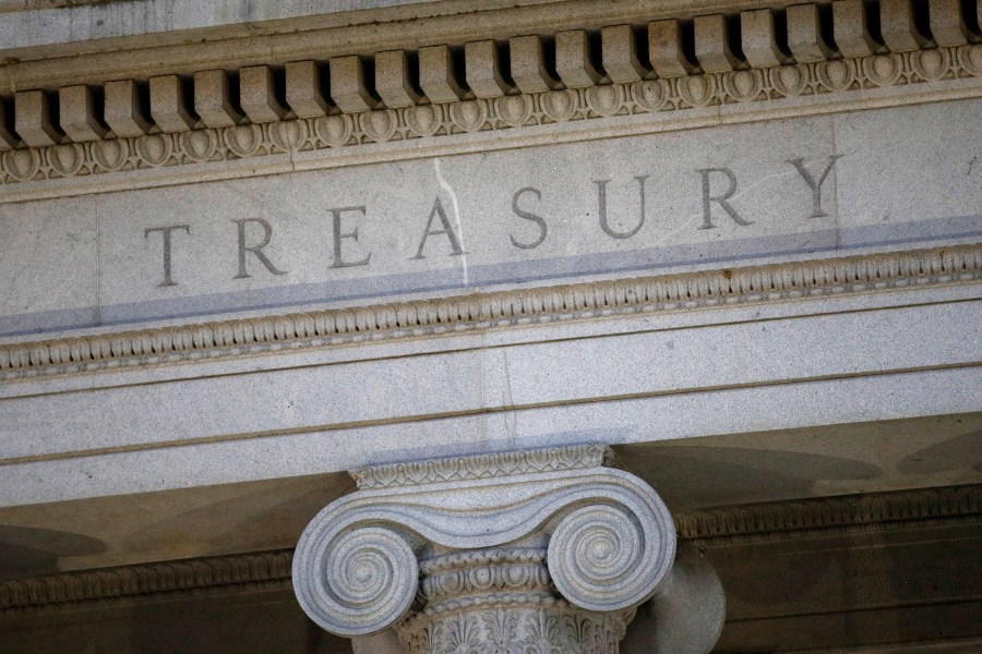 FILE- The U.S. Treasury Department building is shown at dusk in Washington on June 6, 2019. (AP Photo/Patrick Semansky, File)