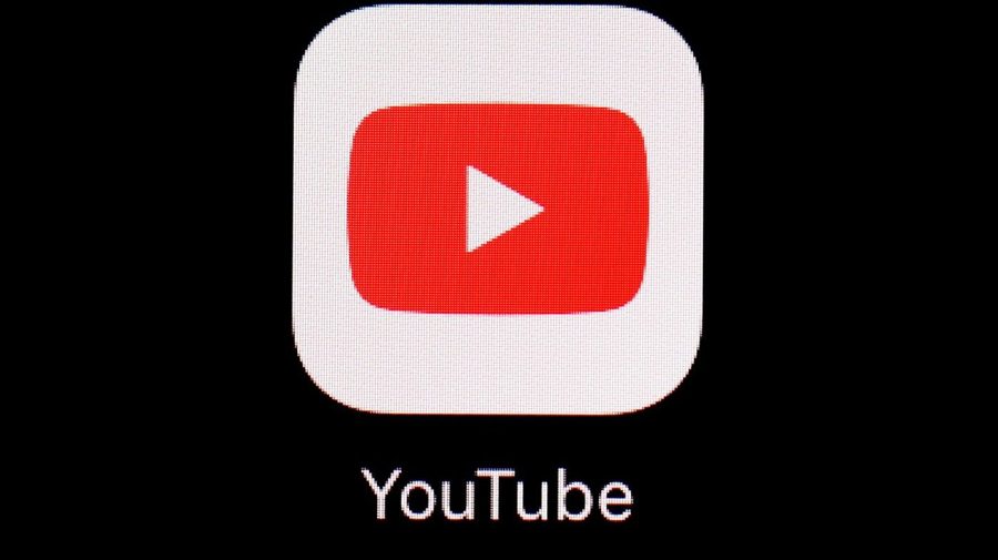 FILE - This March 20, 2018, file photo shows the YouTube app on an iPad in Baltimore. YouTube is rolling out new rules for AI content, Tuesday, Nov. 14, 2023, including requiring creators to reveal whether they've used generative artificial intelligence to make realistic looking videos. (AP Photo/Patrick Semansky, File)