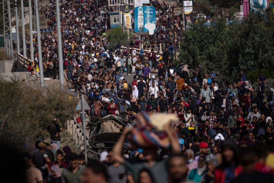 FILE - Palestinians flee to the southern Gaza Strip on Salah al-Din Street in Bureij, Gaza Strip on Nov. 10, 2023. As the military sets its sights on southern Gaza in its campaign to stamp out Hamas, key challenges loom. International patience for a protracted invasion has begun to wear thin. And with some 2 million displaced Gaza residents staying in crowded shelters in the south in dire conditions, a broad military offensive there could unleash a new humanitarian disaster during the cold, wet winter. (AP Photo/Fatima Shbair, File)