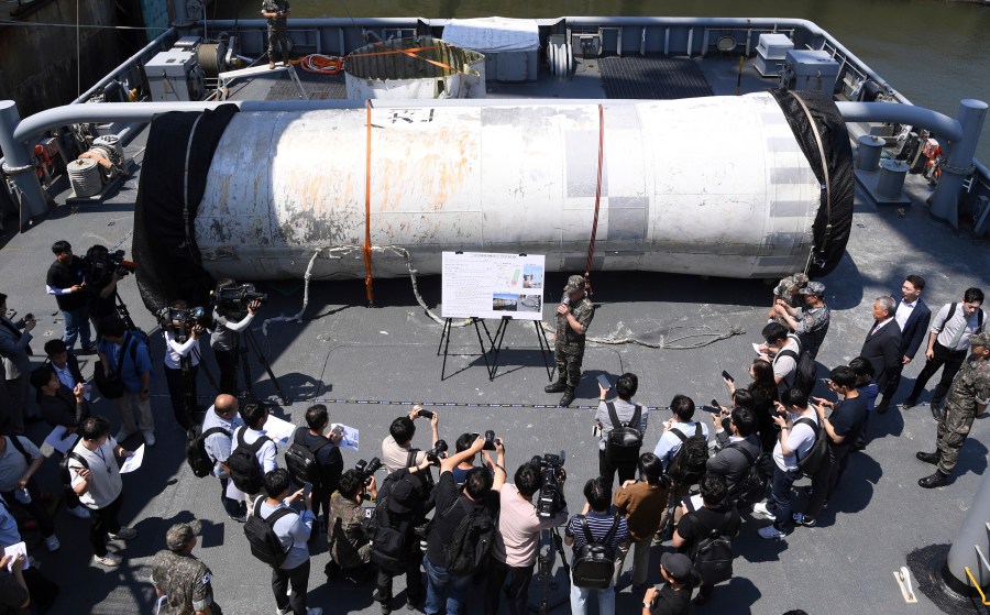 FILE - Objects salvaged by South Korea's military that are presumed to be parts of the North Korean space-launch vehicle that crashed into sea following a launch failure, are displayed at the Navy's 2nd Fleet Command in Pyeongtaek, South Korea, on June 16, 2023. South Korea’s military warned North Korea not to go ahead with its planned spy satellite launch, suggesting Monday, Nov. 20, 2023 that Seoul could suspend an inter-Korean peace deal and resume frontline aerial surveillance in retaliation for a launch. (Yonhap via AP, File)