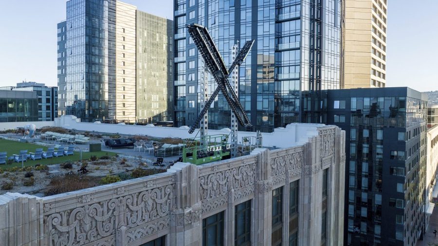 FILE - An "X" sign rests atop the company headquarters in downtown San Francisco, on July 28, 2023. Elon Musk's social media company, formerly known as Twitter, has filed a lawsuit against liberal advocacy group Media Matters for America. X says Media Matters manufactured a report to show advertisers' posts alongside neo-Nazi and white nationalist posts in order to "drive advertisers from the platform and destroy X Corp.” (AP Photo/Noah Berger, File)