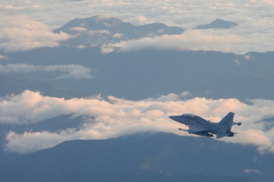 In this handout photo released by the Philippine Air Force, a Philippine Air Force FA-50PH jet fighter joins the maritime patrol of the Philippines and the United States over Batanes and areas in the West Philippine Sea on Tuesday, Nov. 21, 2023.