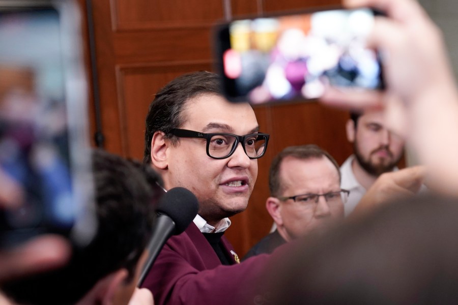 FILE - Rep. George Santos, R-N.Y., talks to reporters as House Republicans hold a caucus meeting at the Capitol in Washington, Friday, Oct. 13, 2023. Santos has said he expected to be expelled from Congress following a scathing report by the House Ethics Committee that found substantial evidence of lawbreaking by the New York Republican. The comments on Friday, Nov. 24, came during a three-hour conversation on X Spaces in which Santos lashed out at colleagues and described the committee's report as “slanderous.” (AP Photo/Mariam Zuhaib, File)