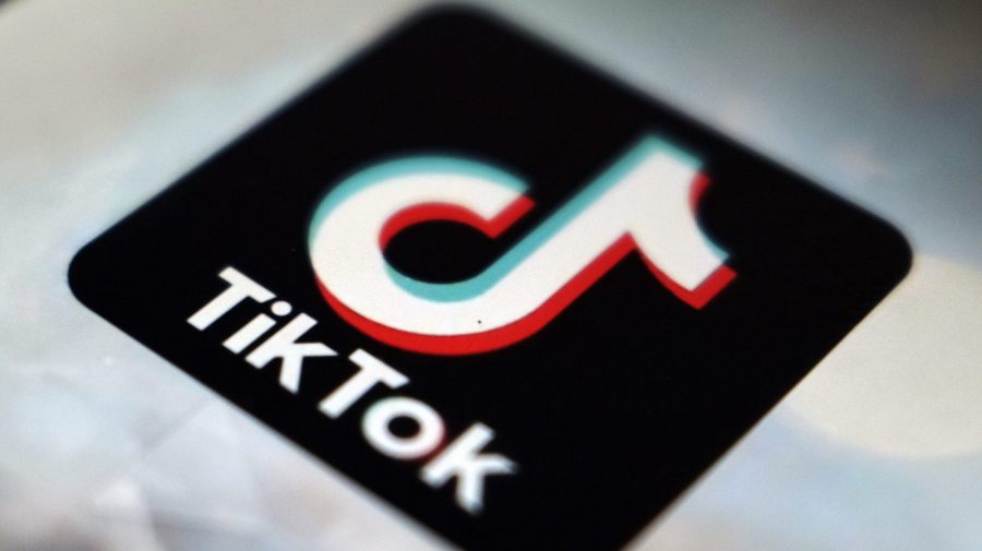 The TikTok app logo is seen at an angle in a close-up.