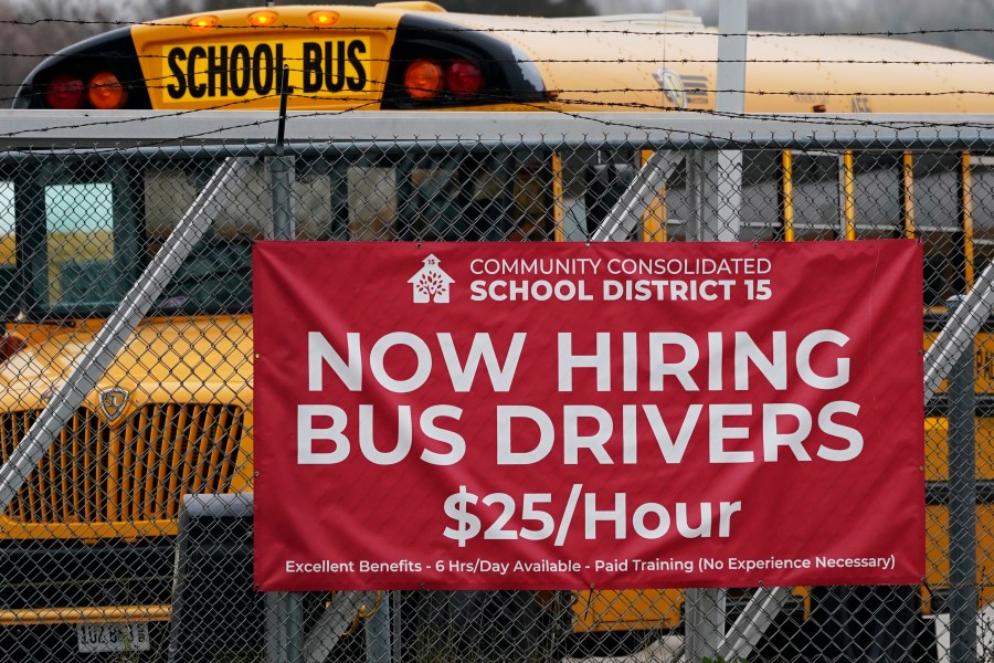 A hiring sign is displayed at a school in Palatine, Ill., Wednesday, Nov. 8, 2023. On Thursday, the Labor Department reports on the number of people who applied for unemployment benefits last week. (AP Photo/Nam Y. Huh)