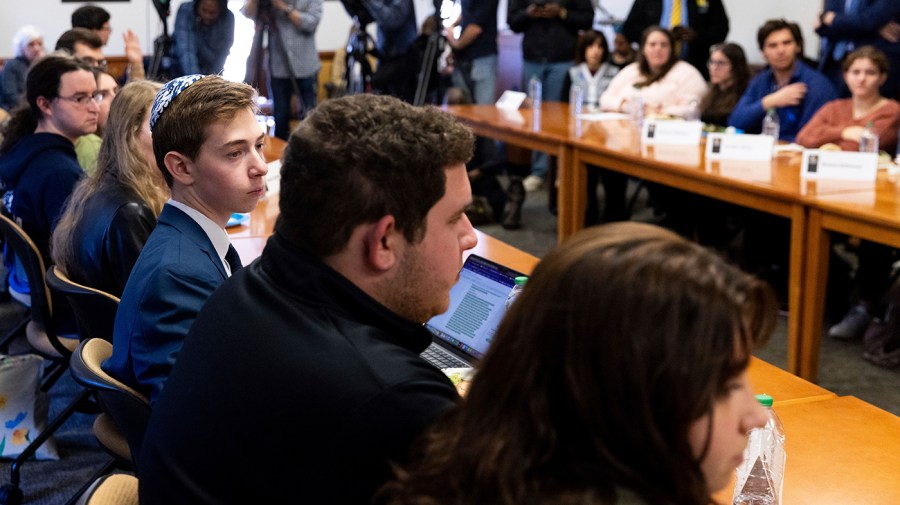 Students listen to Education Secretary Miguel Cardona during his visit to Towson University to discuss antisemitism on college campuses, Thursday, Nov. 2, 2023, in Towson, Md.