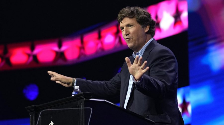 FILE - Tucker Carlson speaks at the Turning Point Action conference, Saturday, July 15, 2023, in West Palm Beach, Fla. Carlson, the ousted Fox News host, announced Monday, Dec. 11, that he is starting his own streaming service, promising to “tell the unadorned truth” to fans for $72 a year. (AP Photo/Lynne Sladky, File)