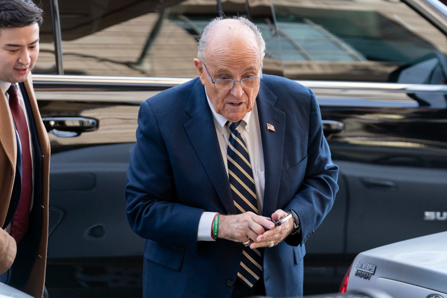 Former Mayor of New York Rudy Giuliani arrives at the federal courthouse in Washington, Wednesday, Dec. 13, 2023. The trial will determine how much Rudy Giuliani will have to pay two Georgia election workers who he falsely accused of fraud while pushing President Donald Trump's baseless claims after he lost the 2020 election. (AP Photo/Jose Luis Magana)