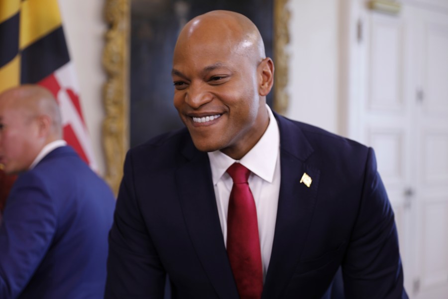 FILE - Maryland Gov. Wes Moore smiles as he gives reporters an update on negotiations with the Baltimore Orioles about a new lease during a news conference on Wednesday, Dec. 13, 2023 in Annapolis, Md. A long-term agreement between the Baltimore Orioles and the Maryland Stadium Authority for a new lease at Camden Yards is moving forward for a vote by state officials next week, Gov. Wes Moore announced. The agreement is slated to go before the Maryland Stadium Authority on Monday, Dec. 18. (AP Photo/Brian Witte, File)