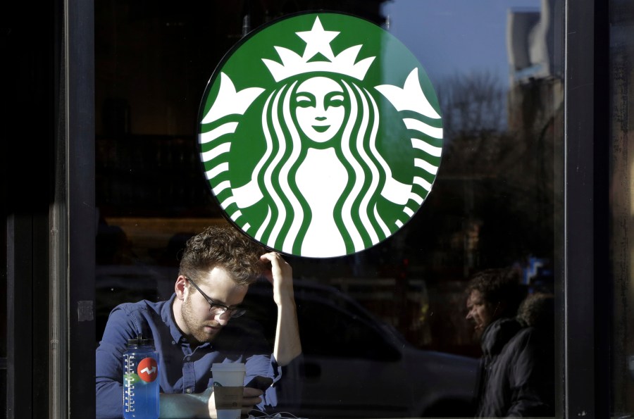 FILE - A man sits inside a Starbucks, in New York, Jan. 11, 2016. An independent review of Starbucks' labor relations concluded that Starbucks should better communicate its commitment to workers’ collective bargaining rights and train its employees to respect those rights. Starbucks released the assessment Wednesday, Dec. 13, 2023. (AP Photo/Mark Lennihan, File)