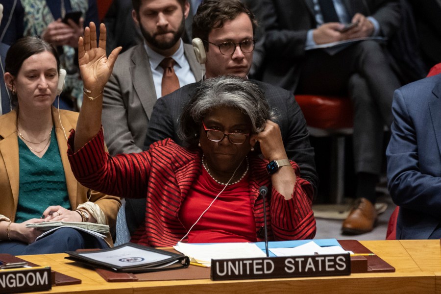 US Ambassador to the UN Linda Thomas-Greenfield raises hand to vote during the Security Council meeting at United Nations headquarters, Friday, Dec. 22, 2023. After many delays, the U.N. Security Council adopted a watered-down resolution Friday calling for immediately speeding up aid deliveries to desperate civilians in Gaza but without the original call for an “urgent suspension of hostilities” between Israel and Hamas. (AP Photo/Yuki Iwamura)