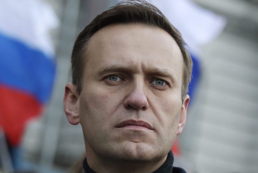 FILE - Russian opposition activist Alexei Navalny takes part in a march in memory of opposition leader Boris Nemtsov in Moscow, Russia on Feb. 29, 2020. Associates of imprisoned Russian opposition leader Alexei Navalny say he has been located at a prison colony above the Arctic Circle nearly three weeks after contact with him was lost. Navalny, the most prominent foe of Russian President Vladimir Putin, is serving a 19-year sentence on charges of extremism. (AP Photo/Pavel Golovkin, File)