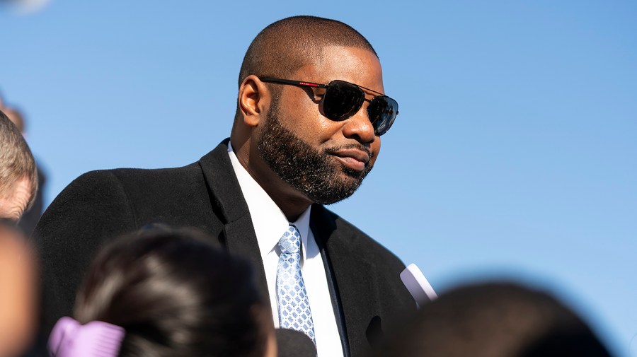 Representative Byron Donalds leaves the House Chamber.