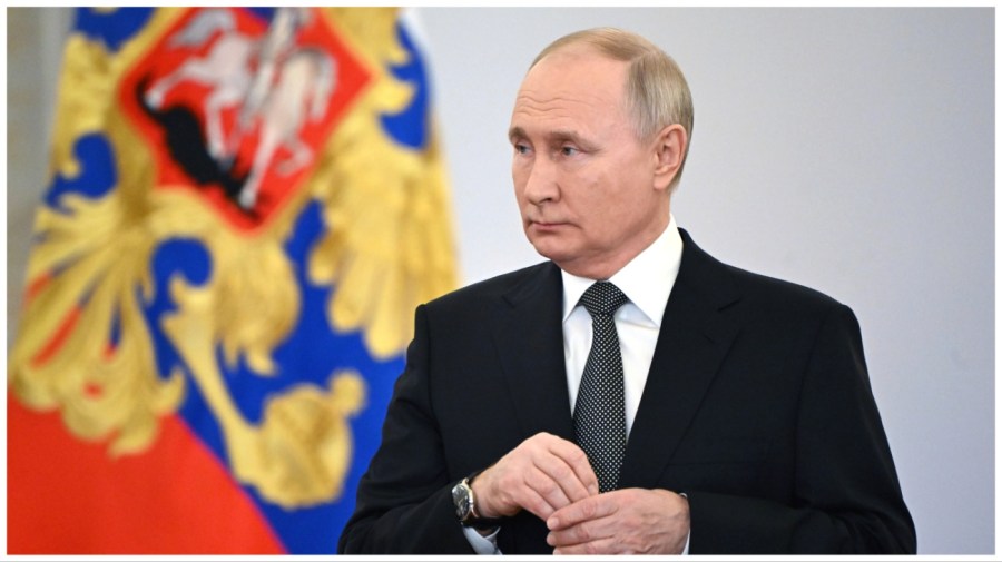 Russian President Vladimir Putin attends a ceremony to present Gold Star medals to Heroes of Russia on the eve of Heroes of the Fatherland Day at the St. George Hall of the Grand Kremlin Palace, in Moscow, Russia, Friday, Dec. 8, 2023. (Sergei Guneyev, Sputnik, Kremlin Pool Photo via AP)