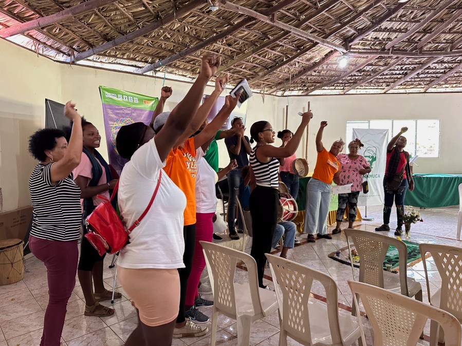 Members of the National Confederation of Rural Women (CONAMUCA) sing during a visit from U.S. legislators and members of Women’s Equality Center at the organization’s headquarters in San Cristobal, Dominican Republic, Friday, Dec.8, 2023. The Women's Equality Center set up a visit for U.S. legislators to visit the D.R. to see first hand the effects of the nation's total abortion ban. (AP Photo/Maria Hernandez)