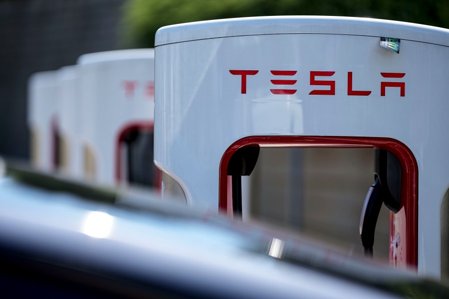 FILE - A Tesla charging station is seen, Sept. 28, 2023, in Woodstock, Ga. Tesla is recalling more than 1.6 million Model S, X, 3 and Y models in China for problems with their automatic assisted steering functions and door latch controls. (AP Photo/Mike Stewart, File)