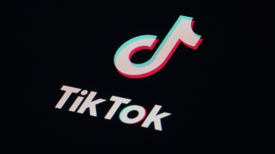 FILE - The icon for the video sharing TikTok app is seen on a smartphone, Feb. 28, 2023, in Marple Township, Pa. TikTok has restricted one tool researchers use to analyze popular videos, a move that follows a barrage of criticism directed at the social media platform about content related to the Israel-Hamas war and a study that questioned whether the company was suppressing topics that don’t align with the interests of the Chinese government. (AP Photo/Matt Slocum, File)