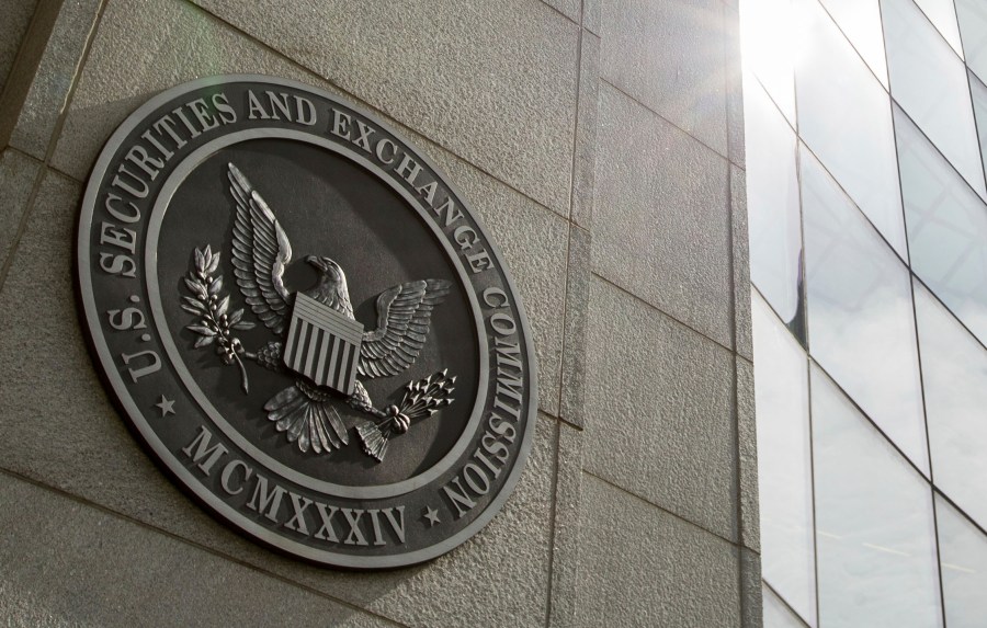 FILE - The seal of the U.S. Securities and Exchange Commission at SEC headquarters, June 19, 2015, in Washington. The Securities and Exchange Commission said Tuesday, Jan. 9, 2024, that a post on X, formerly known as Twitter, announcing that the securities regulator had approved the trading of exchange-traded funds holding bitcoin was fake, and that the agency’s account had been “compromised.” (AP Photo/Andrew Harnik, File)