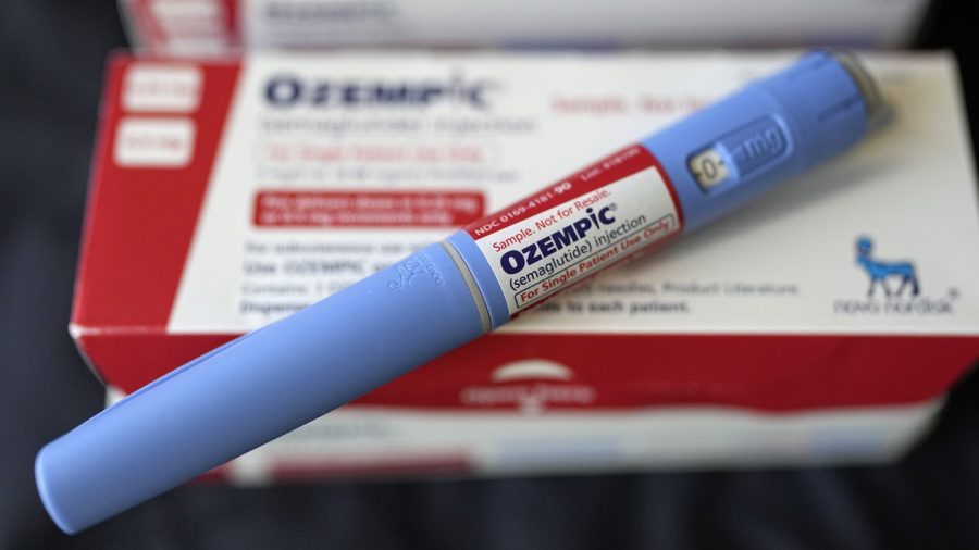 The injectable drug Ozempic is shown on top of its packaging.