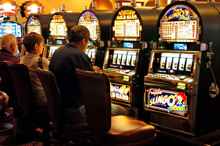 FILE - Customers play the slots at Buffalo Thunder Resort and Casino in Oct. 2008, at the Pojoaque Pueblo, New Mexico. The New Mexico Supreme Court on Tuesday, Jan. 16, 2024, ruled that tribal courts have jurisdiction over personal injury and property damage cases brought against Native American casinos, ending a long battle that saw pueblos and other tribes advocate for protecting sovereignty when such legal claims arise. (Clyde Mueller/Santa Fe New Mexican via AP, File)