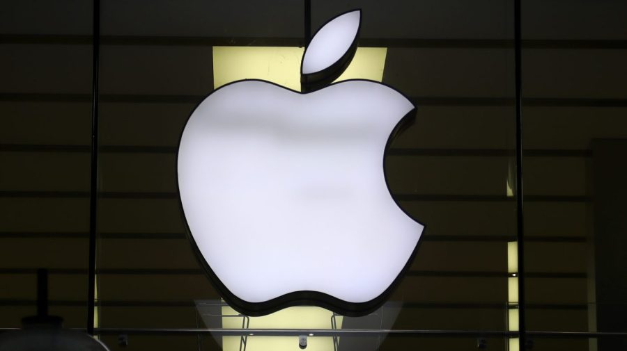 FILE - The Apple logo is illuminated at a store in the city center of Munich, Germany, Dec. 16, 2020. A potential redesign of two Apple Watch models, the Series 9 and Ultra 2, that would exclude the blood oxygen sensor has been approved by the U.S. Customs and Border Protection, according to a Monday, Jan. 15, 2024, court filing by Masimo, a Southern California company pursuing the patent claim. (AP Photo/Matthias Schrader, File)