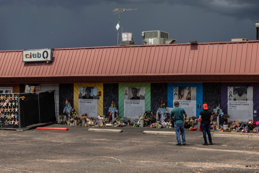 FILE - People visit a memorial outside Club Q, the LGBTQ nightclub that was the site of a deadly 2022 shooting that killed five people, June 7, 2023, in Colorado Springs, Colo. The shooter who was sentenced to life in prison for killing five people the club in Colorado Springs was charged with federal hate crimes and weapons violations on Tuesday, Jan. 16, 2024. (AP Photo/Chet Strange, File)