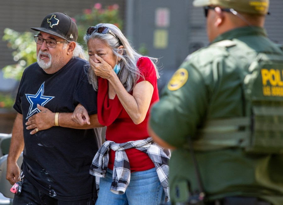 FILE - A woman cries as she leaves the Uvalde Civic Center, Tuesday May 24, 2022, in Uvalde, Texas, after a mass shooting. AA federal report into the halting and haphazard law enforcement response to a school shooting in Uvalde, Texas, was scheduled to be released Thursday, Jan. 18, 2024, reviving scrutiny of the hundreds of officers who responded to the 2022 massacre but waited more than an hour to confront and kill the gunman. (William Luther/The San Antonio Express-News via AP, File)