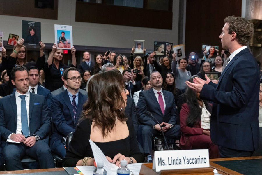 Meta CEO Mark Zuckerberg turns to address the audience during a Senate Judiciary Committee hearing on Capitol Hill in Washington, Wednesday, Jan. 31, 2024, to discuss child safety. X CEO Linda Yaccarino watches at left. (AP Photo/Jose Luis Magana)